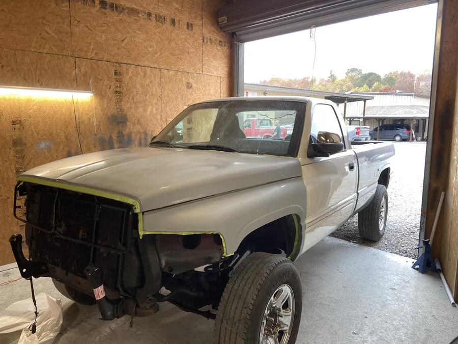 A Dodge pickup in primer in the bay