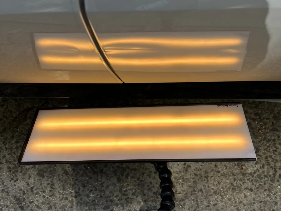The LED board reading a dent on a panel